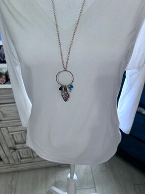 Delicate Gold-Tone Circle Pendant Necklace with Blue and Teal Accents